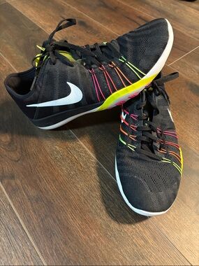 Nike Black Trainers with White Swoosh and Neon Lace Accents